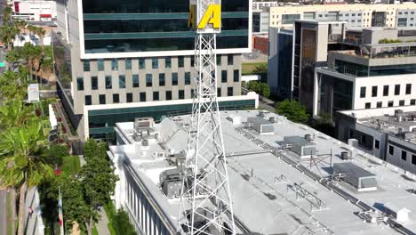 KTLA-5-channel-news-TV-and-radio-broadcasting-station-tower,-Aerial-rising,-Los-Angeles,-California