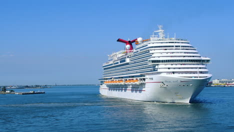 Huge-Luxury-cruise-ship-Carnival-Vista-turning-and-drifting-in-ocean-|-A-Huge-cruise-ship-front-to-side-view-taking-turn-on-port-video-background-|-Travel,-Vacation,-holidays,-Carnival