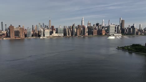 A-high-angle-aerial,-establishing-shot-of-Manhattan-east-side-in-New-York-City-on-a-sunny-day