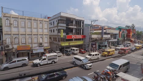 Time-Lapse-of-a-Busy-Streets-in-Olongapo-City,-Philippines-with-Clouds-and-Sky-in-the-Background