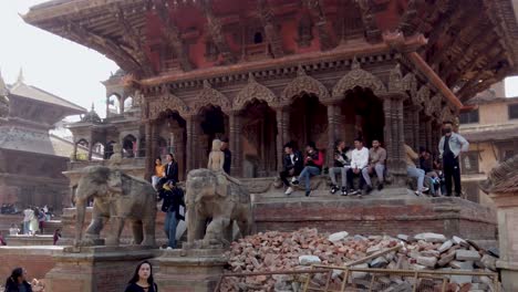Shot-of-Nepalese-People-Seatting-on-a-temple,-chilling-and-Chatting-To-each-Others-Kathmandu-Nepal