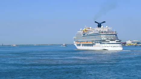 Luxury-cruise-ship-Carnival-Vista-Sailing-from-Port-of-Miami,-Florida,-USA-|-Cruise-Vacation-in-Carnival-video-background-|-Carnival-Cruise-ship-sailing-in-Caribbean-sea