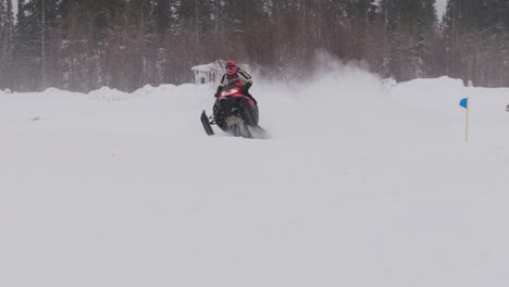 Polaris-RMK-800-snowmobile-racing-over-hills-in-slow-motion