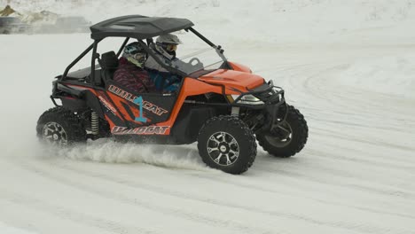 Arctic-Cat-side-by-side-drifting-through-corner-in-ice-racing