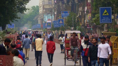 People-walking-at-the-busy-street-of-newly-developed-Chandni-Chowk-in-old-Delhi,-India