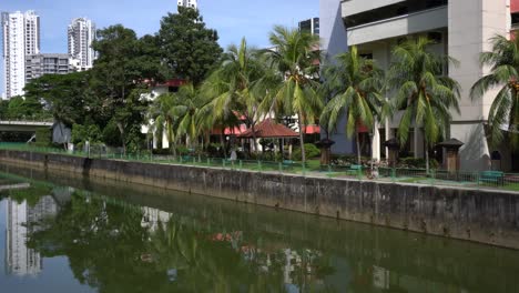 River-canal,-open-air-fitness-and-resting-corner-below-the-estate-of-a-housing-residential-area-in-Ah-Hood-Gardens,-HDB-neighbourhood-in-Balestier,-Singapore