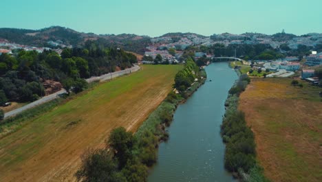 The-tranquil-Mira-River-flowing-through-Odemira,-Portugal