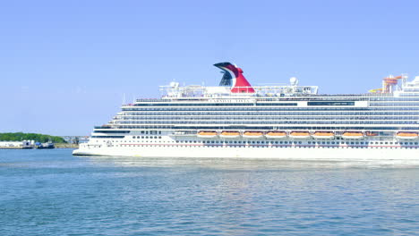 Luxury-Carnival-cruise-ship-side-view-turning-in-ocean-video-background-|-Huge-luxury-cruise-ship-on-port-in-Miami-video-background-|-Travel,-Tourism,-Carnival,-Luxury,-cruising,-iconic,-symbolic
