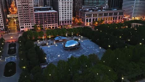 Aerial-view-around-the-Bean,-Cloud-Gate-in-gloomy-Millennium-Park,-Chicago,-USA---orbit,-drone-shot