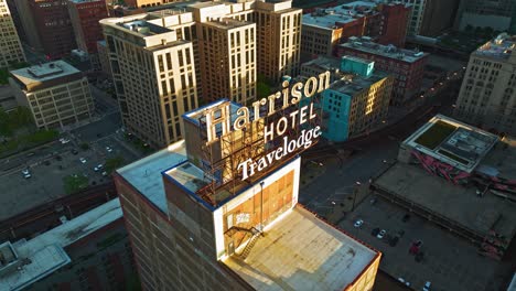 Aerial-view-around-the-Harrison-hotel-Travelodge,-golden-hour-in-Chicago,-USA---orbit,-drone-shot