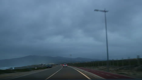 Car-ride-in-the-afternoon-at-Guincho's-road-in-the-Portuguese-coast