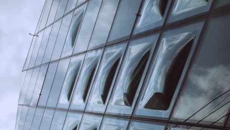 VERTICAL-view-low-angle-to-the-top-of-Tokyo-Prada-geometric-diamond-glass-building