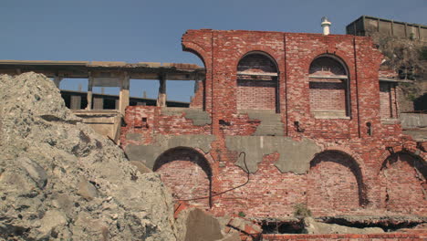 View-of-red-bricks-at-abandoned-building-on-Hashima-Island-in-Nagasaki,-Japan