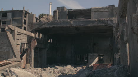 View-looking-into-rubble-and-damaged-buildings-on-Hashima-Island,-commonly-called-Gunkanjima,-Nagasaki,-Japan