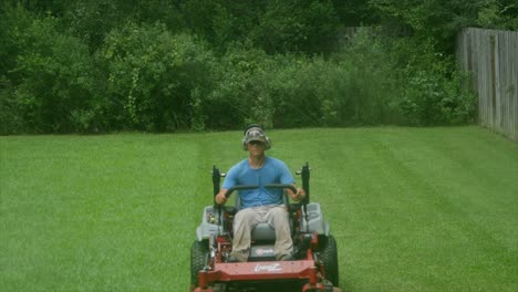 Riding-and-operating-a-mower