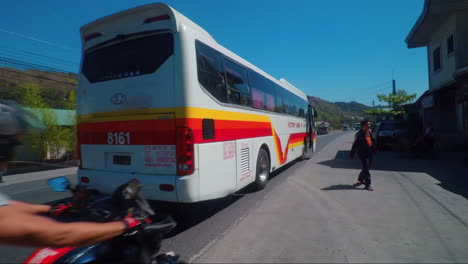 Victory-Liner-Bus-Passing-In-A-highway-with-Passenger,-Philippines