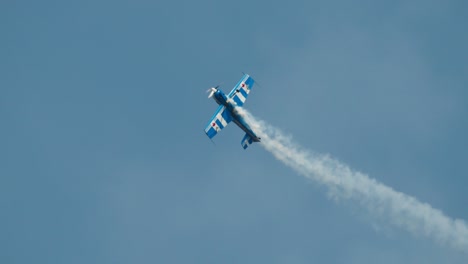 Close-up-of-stunt-plane-performing-aileron-roll