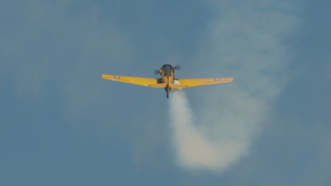 Close-up-of-North-American-Harvard-Mark-IV-airplane-climbing-at-air-show-in-slow-motion