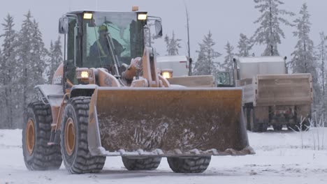 Female-heavy-equipment-operator-drivng-loader-on-job-site