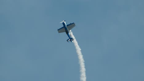 Close-up-of-stunt-plane-in-steep-vertical-climb