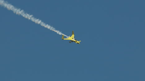 Closeup-aerobatic-stunt-plane-diving-with-smoke-trail