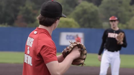 Two-baseball-players-playing-catch-before-tryouts