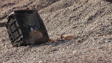 close-up-of-an-old-TV-screen-been-smashed-by-a-rock