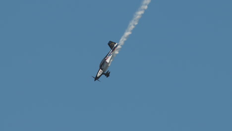 Close-up-of-F1-Rocket-or-Harmon-Rocket-II-airplane-pulling-out-of-a-dive-with-smoke-trail-at-an-airshow-in-slow-motion