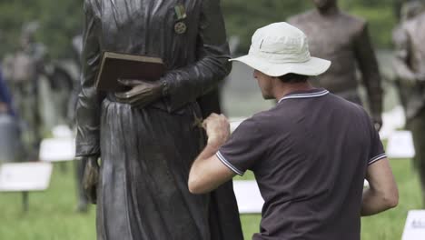 Restorer-Touching-Up-Sculpture-At-National-Heritage-Monument-In-Cape-Town,-South-Africa