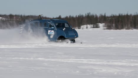 Bombardier-snow-bus-speeding-across-frozen-lake-near-Yellowknife-Northwest-Territories