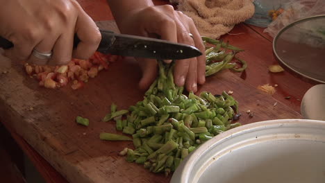 Chopping-Fresh-Green-Beans-On-Wooden-Cutting-Board