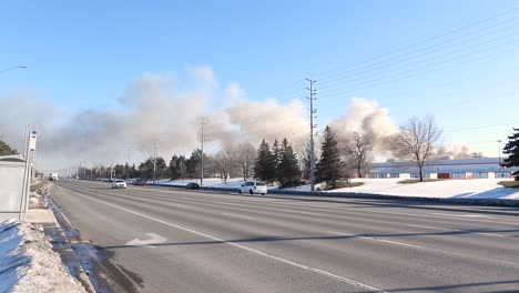 Smoke-Rising-From-Accidental-Fire-In-The-City-Of-Brampton-In-Ontario,-Canada-At-Daytime