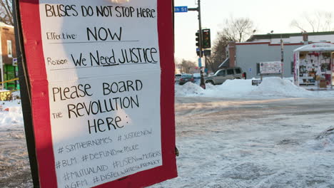 A-sign-demanding-justice-for-the-death-of-George-Floyd-outside-Cup-Foods,-the-neighborhood-shop-where-Floyd-was-killed-by-Minneapolis-police-officers-in-May-2020