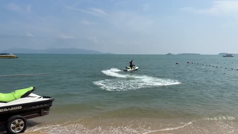 Person-Riding-Jet-Ski-in-Gulf-of-Thailand-at-Bophut-Beach-in-Koh-Samui,-Thailand