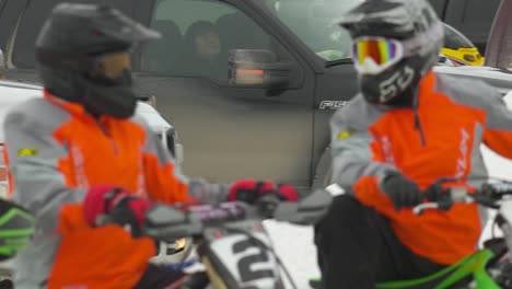 Snowcross-motocross-racers-at-starting-line-waiting-for-race-to-start