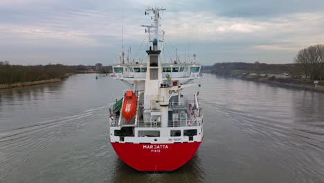 Finnish-containership-Marjatta-sailing-across-Oude-Mass-river,-Zwijndrecht,-Netherland