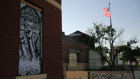 An-American-flag-flies-at-the-3rd-Precinct-Police-Station-in-Minneapolis,-Minnesota