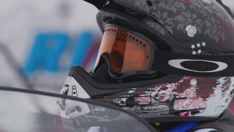 Close-up-of-young-skidoo-snowmobile-rider-with-helmet-on-in-slow-motion