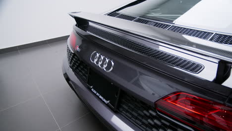 Chrome-Emblem-On-Rear-Of-Audi-R8-Supercar-Display-In-Showroom-Of-Car-Dealership