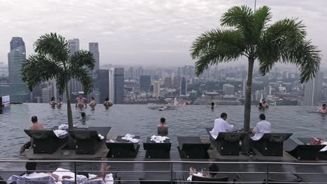 Marina-Bay-Sands-Infinity-Pool-view-over-Urban-Singapore-Landscape---Wide-Establishing-static-shot
