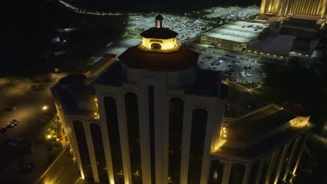 Drone-shot-around-the-L'Auberge-Casino-and-hotel,-night-in-Lake-Charles,-Louisiana,-USA