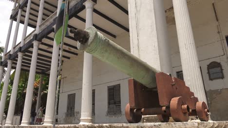 Low-Angle-View-Of-Old-Artillery-Cannon-Outside-House-Of-Wonders-In-Zanzibar