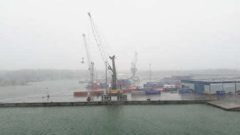 Hail-storm-at-harbor-container-terminal,-static-shot