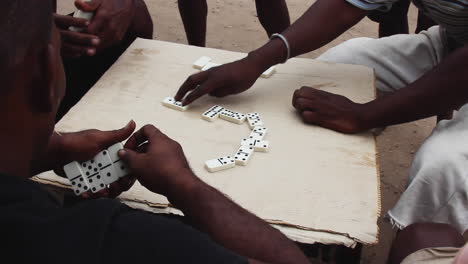 Locals-Playing-Dominoes-Outside-In-Mahajanga,-Madagascar