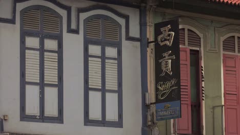 Close-Window-Shutters-Above-Shops-On-Geylang-Road-In-Singapore