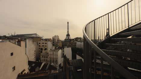 Paris-City-Skyline,-Eiffel-Tower-in-Background,-Dense-Residential-Buildings,-Staircase,-Overcast,-Paris