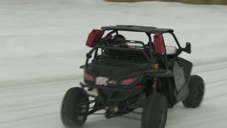 Side-by-Side-drifting-around-corner-in-ice-racing