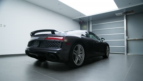 Rear-And-Side-View-Of-Audi-R8-Sports-Car-In-The-Garage-Of-A-Building