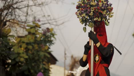 Penitent-Wearing-Red-Capirote-At-The-Holy-Week-Procession-In-Antigua,-Guatemala