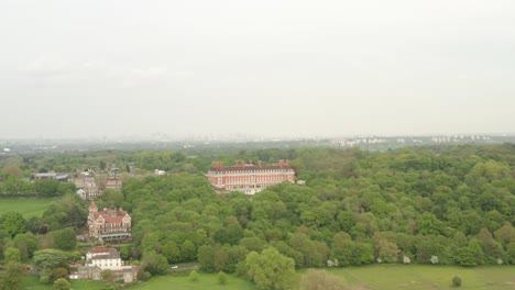 Aerial-shot-over-the-Royal-star-and-Garter-building-and-Richmond-park-towards-London-skyline
